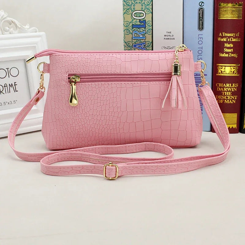 Women's Textured Crossbody Bag with Tassel Strap