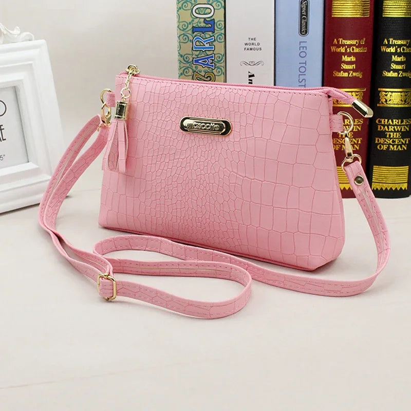 Women's Textured Crossbody Bag with Tassel Strap