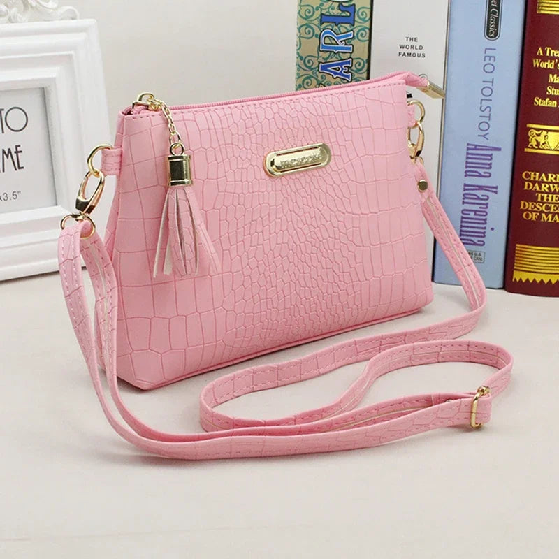 Women's Textured Crossbody Bag with Tassel Strap